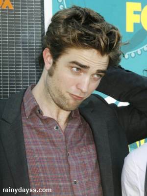 Expressões faciais de Robert Pattinson fotos
